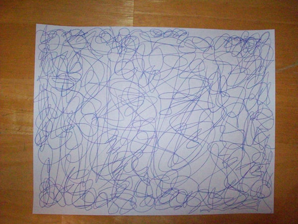 Scribbles on a sheet of paper.